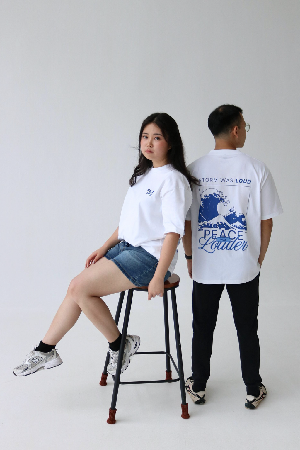 Oversized graphic white T-shirt design - "Storm was loud, peace was louder"