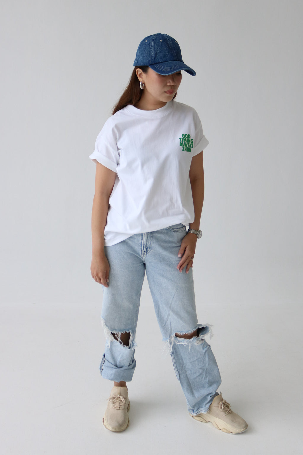 Oversized graphic white T-shirt front design - "God timing always zhun"